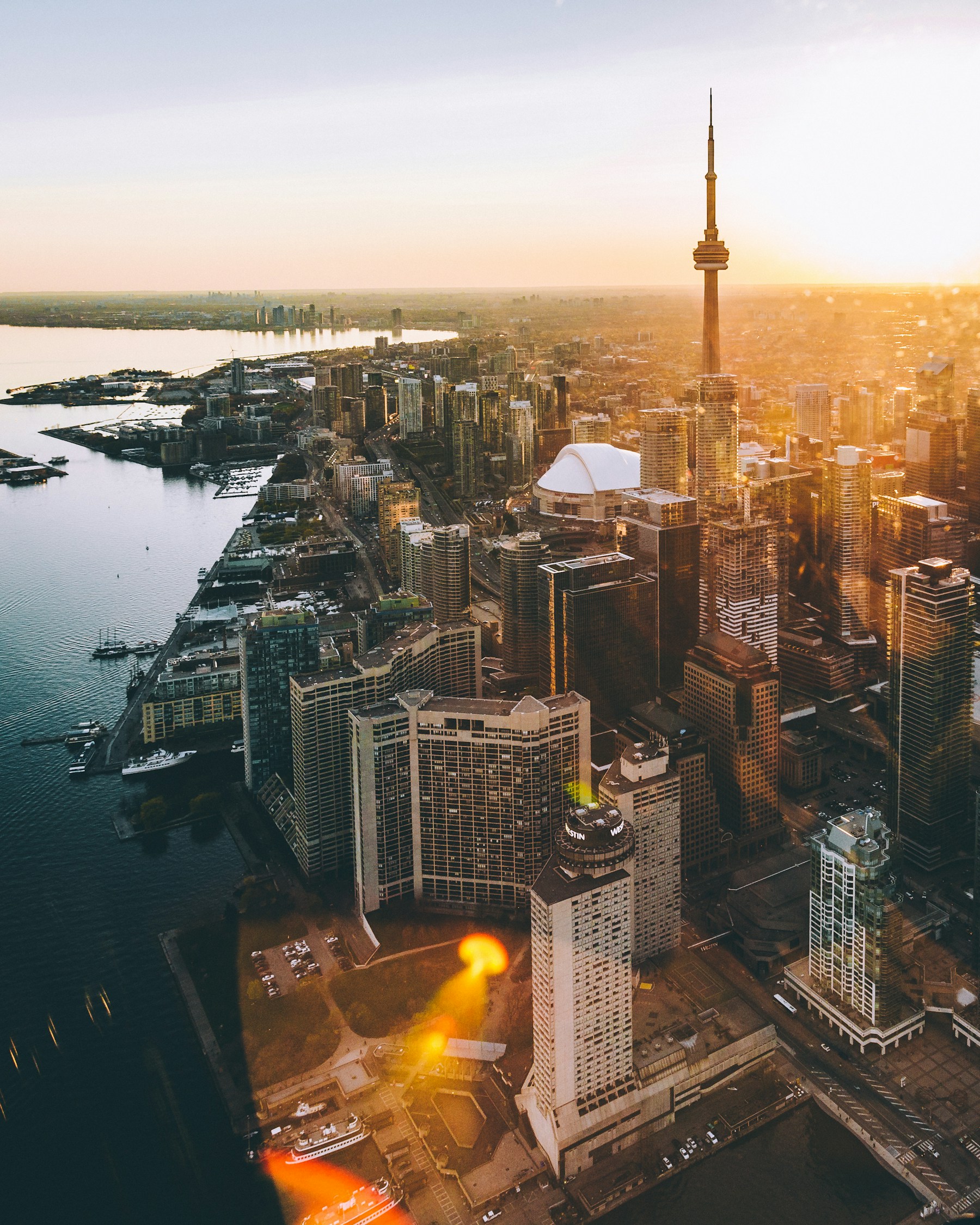 Golden evening light over Toronto’s waterfront and CN Tower